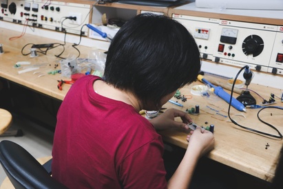 Person working on electronics
